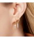 goudkleurige oorbellen met als hanger 3 strass steentjes