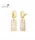 Beige oorclips met een goudkleurig detail