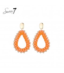Oorbellen met oranje kralen en een goudkleurige rand