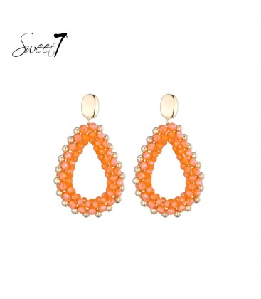 Oorbellen met oranje kralen en een goudkleurige rand