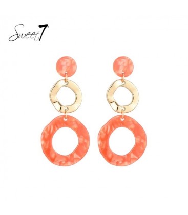 Oorbellen met oranje ronde hanger en goudkleurige schakel
